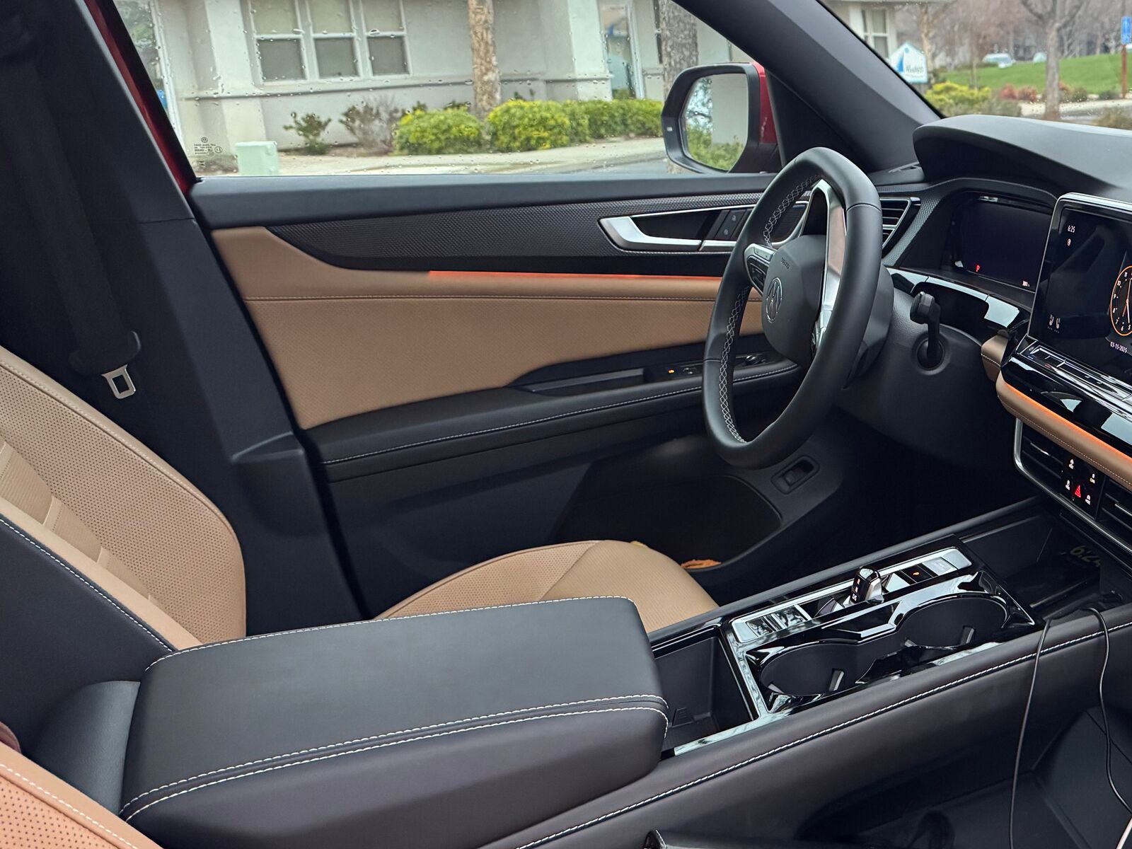 Driver’s seat and dashboard of a Stallion training SUV, tan leather interior