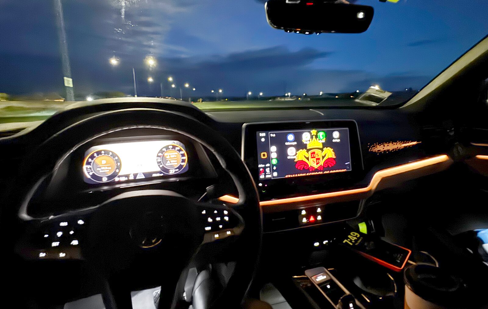 A Stallion training SUV at night with the Stallion crest on the dashboard screen