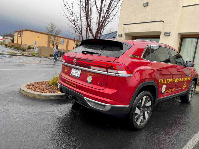 Rear of a Stallion training SUV with the DMV driving school license E0271 decal